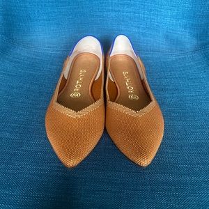 Rothy’s fawn color, pointy.